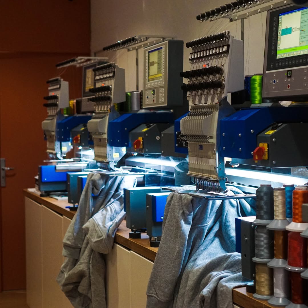Embroidery machines stitching custom hoodies